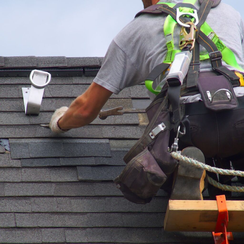 A contractor doing roof repair