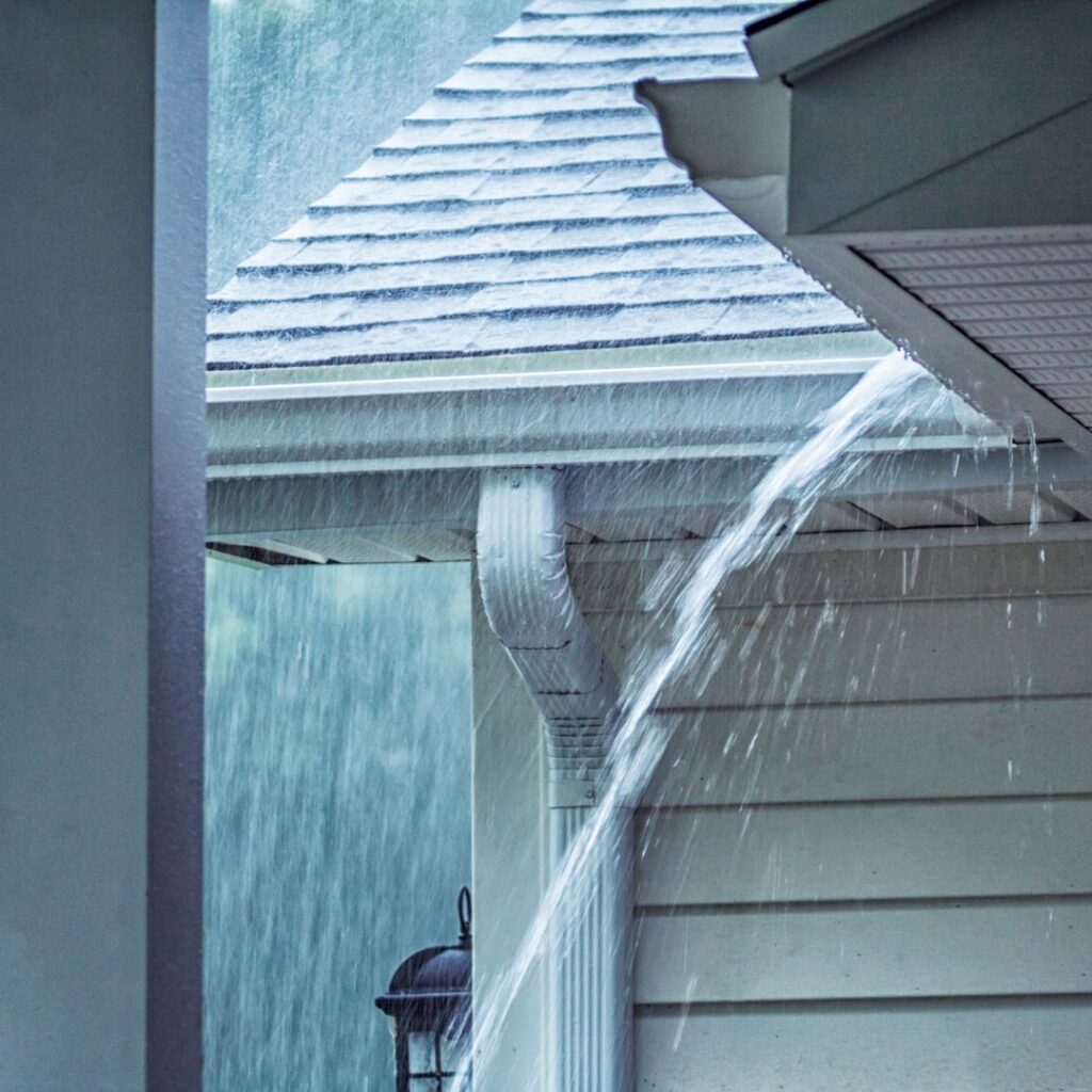 rain storm and overflowing gutters