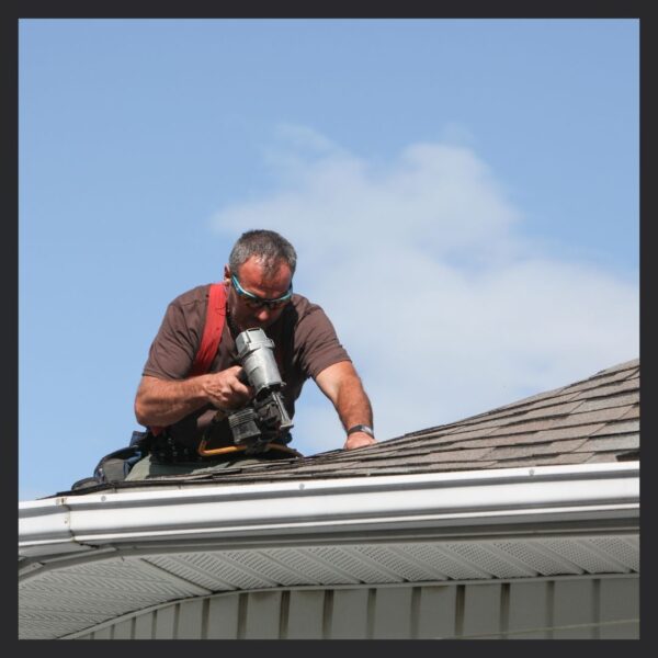 contractor repairing a roof