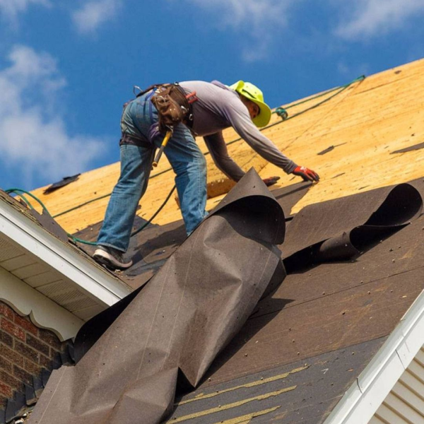 roofer installing roof